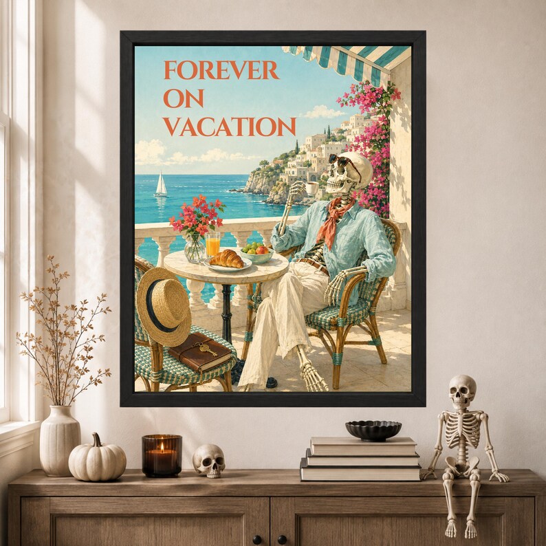 May include: A framed wall art print titled FOREVER ON VACATION featuring a skeleton wearing sunglasses, a light blue shirt, and a red scarf, sitting at a table on a balcony overlooking the sea with a croissant, a drink, and a straw hat.