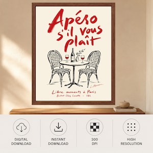 May include: A framed wall art print featuring a cream background with red text that reads Ap&eacute;ro s'il vous pla&icirc;t. Below the text is a black ink illustration of a bistro table with two chairs, a wine bottle, and two glasses. Text at the bottom reads Libre moments &agrave; Paris, Bistrot Chez Lucette, 18h.