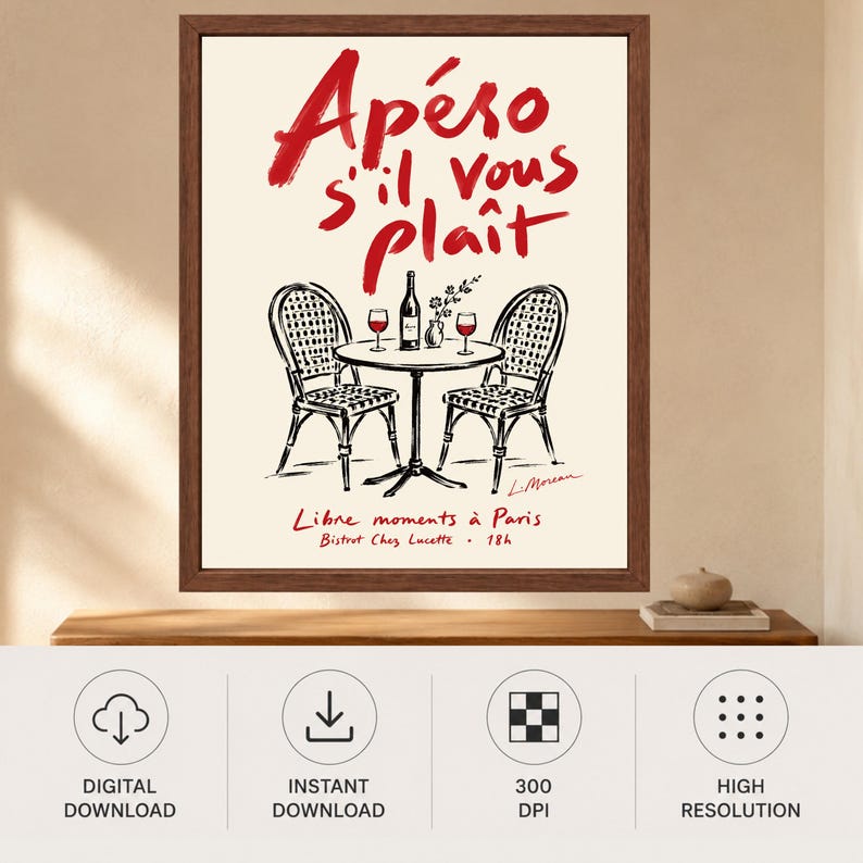 May include: A framed wall art print featuring a cream background with red text that reads Ap&eacute;ro s'il vous pla&icirc;t. Below the text is a black ink illustration of a bistro table with two chairs, a wine bottle, and two glasses. Text at the bottom reads Libre moments &agrave; Paris, Bistrot Chez Lucette, 18h.