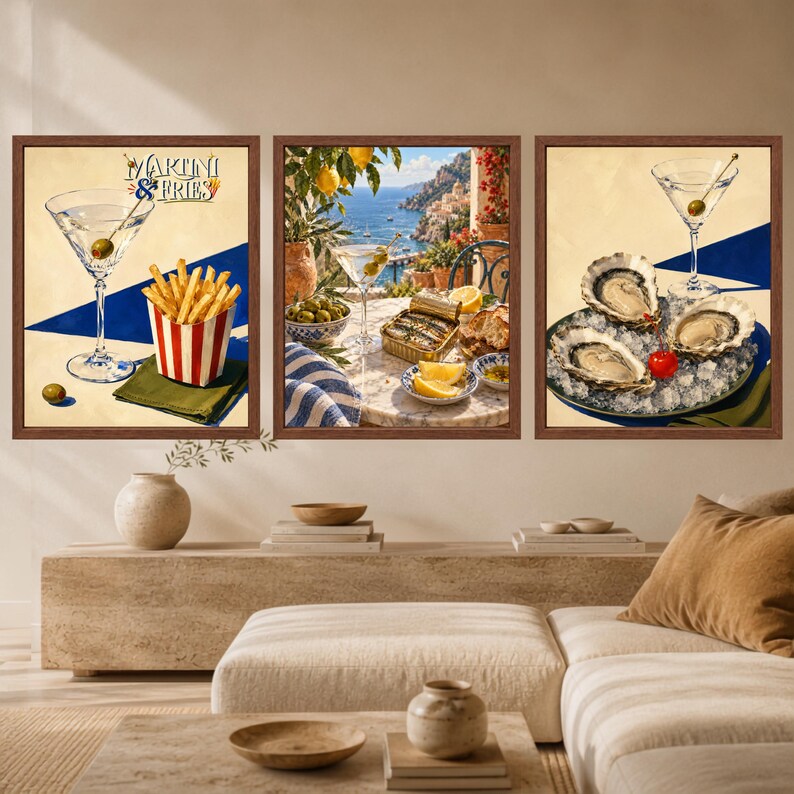 May include: A set of three framed wall art prints. The left print shows a martini and fries with the text MARTINI & FRIES. The center print depicts a coastal scene with a martini, sardines, and lemons. The right print features oysters on ice.
