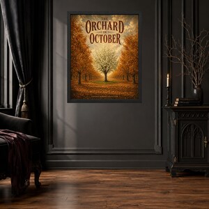 May include: A framed wall art print titled The Orchard in October, featuring a central white tree surrounded by rows of orange and brown autumn trees under a cloudy sky. The text The Orchard in October is printed in a dark brown serif font at the top.