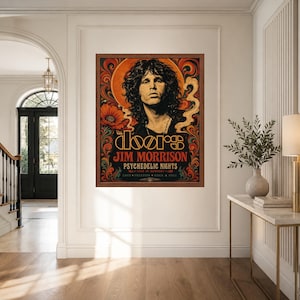 May include: A framed rectangular wall poster featuring a portrait of Jim Morrison with long dark hair. The artwork includes orange, red, and black swirling patterns, floral motifs, and text reading The Doors, Jim Morrison, and Psychedelic Nights.