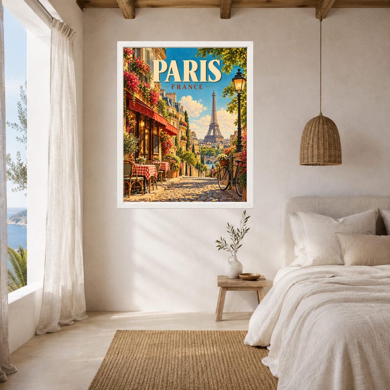 May include: A framed wall art print featuring a vibrant illustration of a Parisian street scene with a sidewalk cafe, red-checkered tables, a bicycle, and the Eiffel Tower in the distance, with the text PARIS FRANCE displayed at the top.