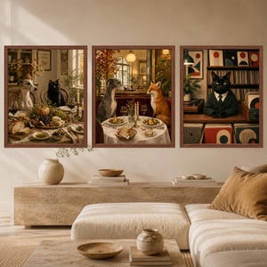 May include: Three framed wall art prints featuring anthropomorphic animals. The first shows a dog and cat at a table, the second a dog and fox dining, and the third a cat in a suit standing before a record collection. Each print has a brown frame.