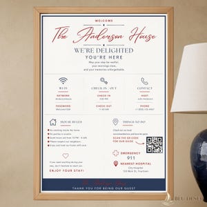 May include: A framed welcome sign for The Anderson House with red and dark blue text on a white background. It includes Wi-Fi details, check-in and check-out times, house rules, emergency contact information, and a QR code for local recommendations.