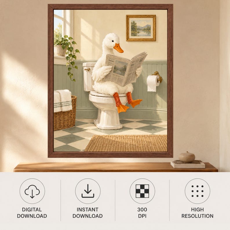 May include: A framed wall art print featuring a white duck with orange feet sitting on a white toilet reading a newspaper. The bathroom scene includes a wicker basket with towels, a potted plant, and a checkered floor, all enclosed in a brown frame.