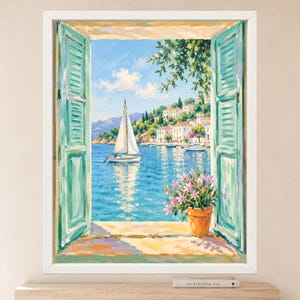 May include: A framed painting depicting an open window with teal shutters looking out onto a coastal scene. A white sailboat floats on blue water near a hillside village with white buildings. A terracotta pot with pink flowers sits on the sill.