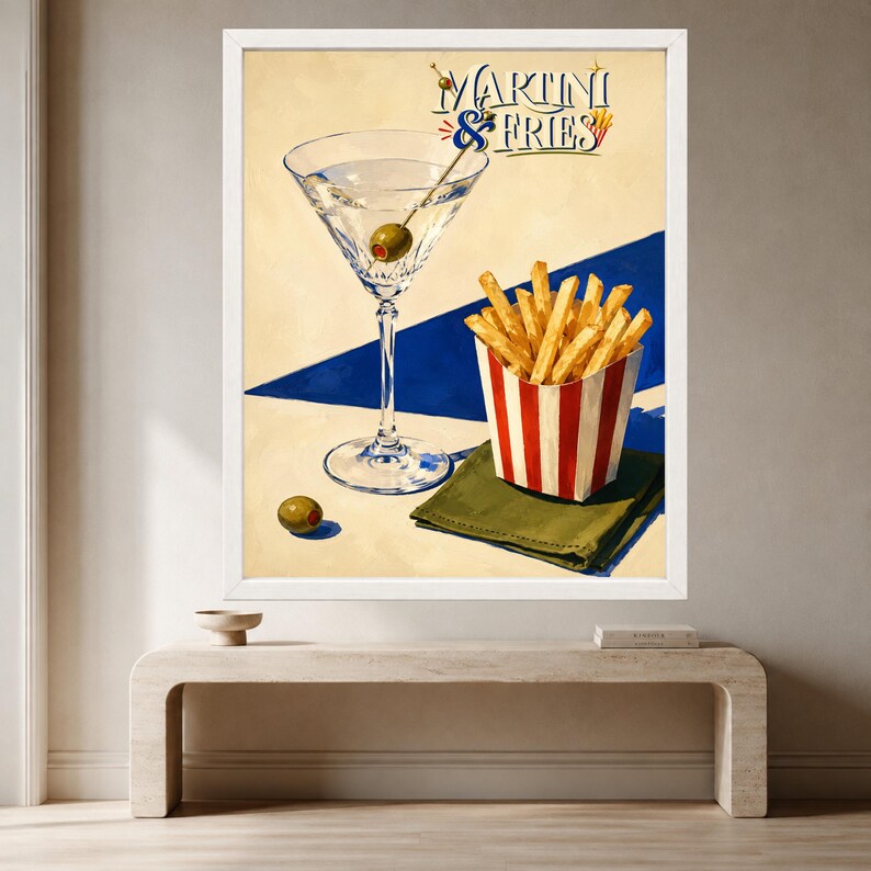 May include: A framed wall art print featuring a martini glass with a green olive on a toothpick, a red and white striped container filled with golden french fries, and a green napkin. The text MARTINI & FRIES is printed at the top in blue.