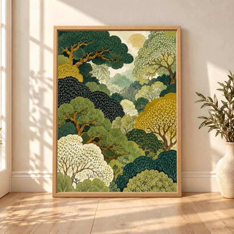Framed forest wall art with layered green, olive, cream and gold trees forming a dense botanical landscape beneath a soft pale sun.