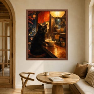 May include: A framed wall art print depicting a black cat sitting at a wooden counter in a dimly lit ramen shop. The cat faces forward next to a steaming bowl of ramen with an egg. A glowing paper lantern hangs above the warm, rustic interior.