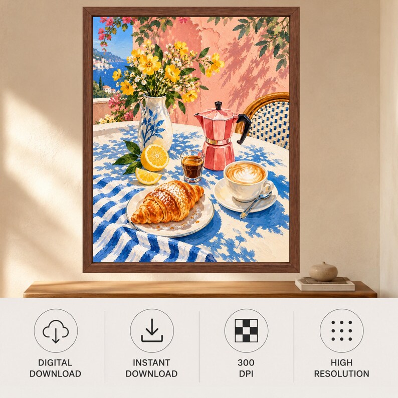 May include: A framed wall art print depicting a breakfast scene on a table with a blue and white striped tablecloth. The scene features a croissant on a plate, a cup of latte, a pink moka pot, a vase of yellow flowers, and lemon slices.