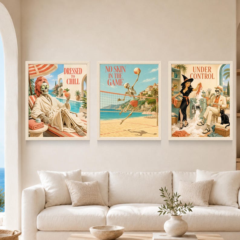 May include: Three framed wall art prints featuring skeleton figures. The first shows a skeleton in a robe with the text DRESSED TO CHILL. The second depicts a skeleton playing volleyball with the text NO SKIN IN THE GAME. The third shows a skeleton and a person with the text UNDER CONTROL.