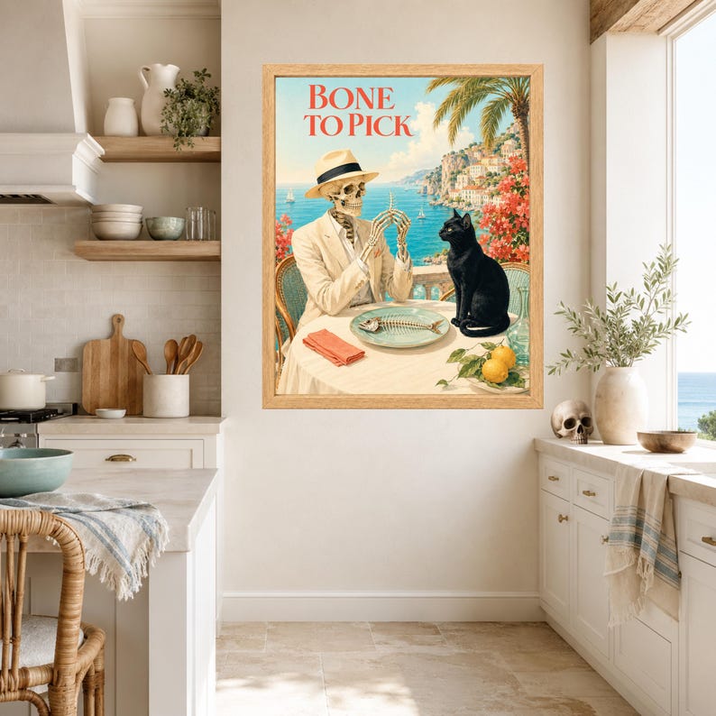 Peut inclure: Une impression d'art encadr&eacute;e intitul&eacute;e BONE TO PICK repr&eacute;sentant un squelette en costume et chapeau beiges assis &agrave; une table avec un chat noir. La sc&egrave;ne montre une vue c&ocirc;ti&egrave;re avec une ar&ecirc;te de poisson sur une assiette, une serviette rouge et deux citrons.