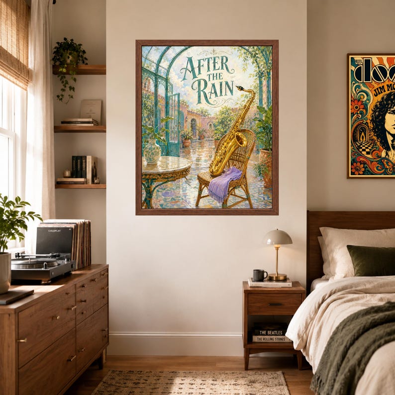 May include: A framed wall art print titled After the Rain, featuring a golden saxophone resting on a wicker chair in a sunlit courtyard. The scene includes a round table, potted plants, and a light purple cloth draped over the chair seat.