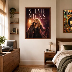 May include: A framed wall poster featuring a photograph of Stevie Nicks performing on stage with a microphone. The text STEVIE NICKS is printed in large white letters at the top, with smaller text reading LIFE IS THE MOMENT MAGIC IS REAL.