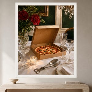 May include: A pepperoni pizza in a cardboard box sits on a white tablecloth next to two crystal wine glasses, a small lit candle in a glass holder, and silver serving tongs. A crystal vase with red flowers stands in the background.