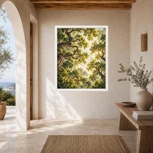 May include: A square wall art print featuring a low-angle view of dense green tree canopies with sunlight filtering through the leaves. The image displays textured tree trunks and a bright, hazy sky visible between the branches in a white frame.