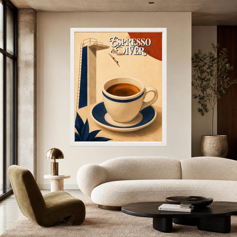 May include: A framed wall art print titled Espresso Diver featuring a cream-colored coffee cup and saucer with blue trim. The illustration includes a high diving board, a diver mid-air, and a large red circle against a beige background.