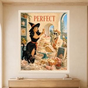 Framed Perfect wall art showing a retro witch decorating a collapsing pink layer cake beside a skeleton in a cream suit while a black cat walks across a messy Mediterranean bakery counter.