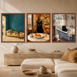 May include: A set of three framed wall art prints. The left print shows a leopard on a yellow chaise lounge. The center print features a black cat with a slice of pumpkin pie. The right print depicts a black cat in a bathtub with the text Five More Minutes.
