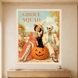 Framed Ghoul Squad Halloween wall art featuring a stylish witch and skeleton sitting beside a black cat inside a jack-o’-lantern, surrounded by pumpkins, autumn flowers and colorful retro decor.