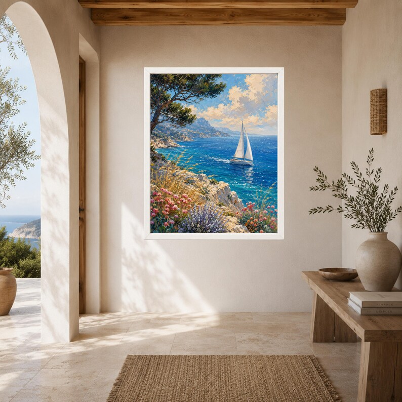 May include: A framed wall art print depicting a coastal landscape with a white sailboat on deep blue water. The scene features rocky cliffs, green trees, and colorful wildflowers in the foreground under a bright blue sky with white clouds.