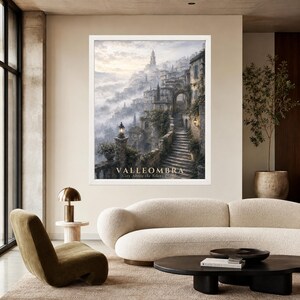 May include: A framed wall art print depicting a misty, hillside village with stone staircases, archways, and lanterns. The text VALLEOMBRA City Above the Silent Clouds is printed at the bottom of the image in a light, serif font.