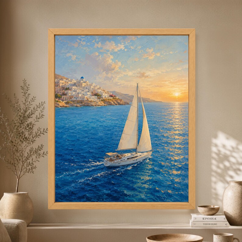 Framed Greek island wall art showing a white sailboat crossing deep blue Aegean water at sunset beside whitewashed hillside houses and a blue-domed church.