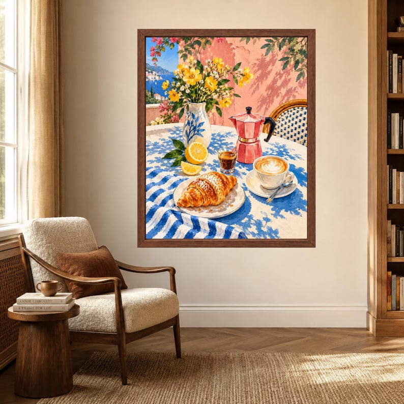May include: A framed wall art print depicting a Mediterranean scene on a table with a blue and white striped tablecloth. The scene features a croissant on a plate, a cup of coffee, a red moka pot, a glass of espresso, and a vase of yellow flowers.
