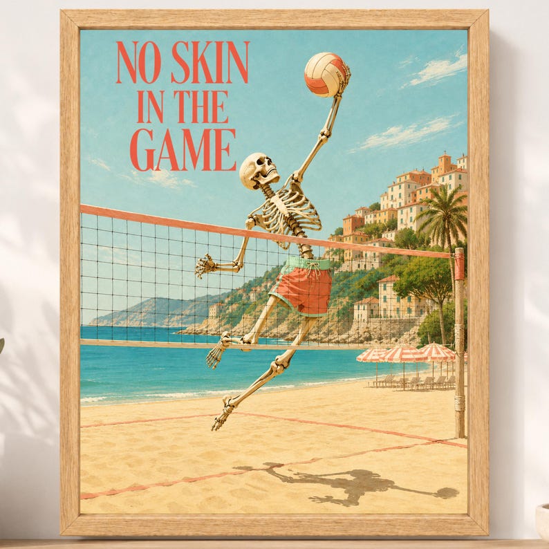 May include: A framed wall art print featuring a skeleton playing volleyball on a beach. The skeleton wears orange shorts and reaches for a volleyball above a net. The text NO SKIN IN THE GAME is printed in red. The background shows a coastal town.
