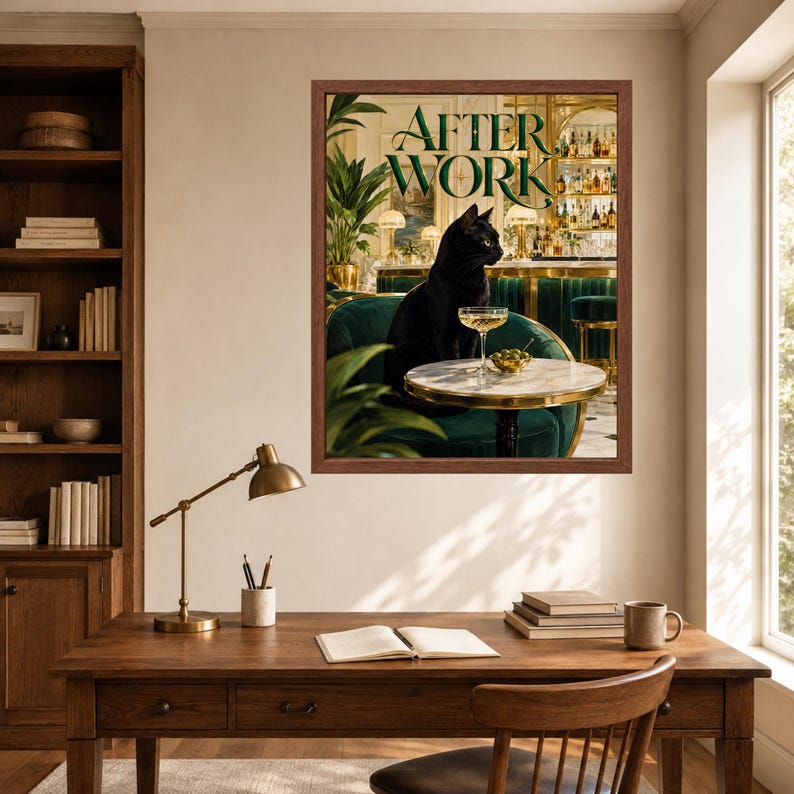 May include: A framed wall art print titled AFTER WORK featuring a black cat sitting on a dark green velvet chair at a small round table with a cocktail glass and a bowl of olives, set in a bar interior with a gold-trimmed back bar display.