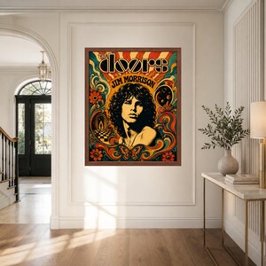 May include: A framed rectangular wall poster featuring a stylised portrait of Jim Morrison with long dark hair. The artwork includes the text THE DOORS and JIM MORRISON surrounded by vibrant orange, yellow, teal, and red swirling patterns.