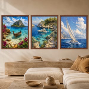 May include: A set of three framed wall art prints featuring coastal scenes. The left print shows a wooden boat in turquoise water with pink flowers. The center print depicts a white yacht near rocky cliffs. The right print shows a sailboat at sea.