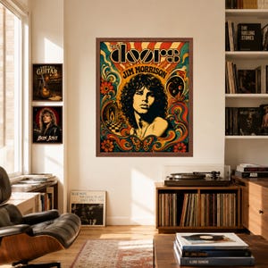 May include: A framed wall poster featuring a portrait of Jim Morrison surrounded by colourful psychedelic patterns, floral motifs, and a butterfly. The text reads THE DOORS and JIM MORRISON. The artwork uses a vibrant palette of orange, teal, and yellow.