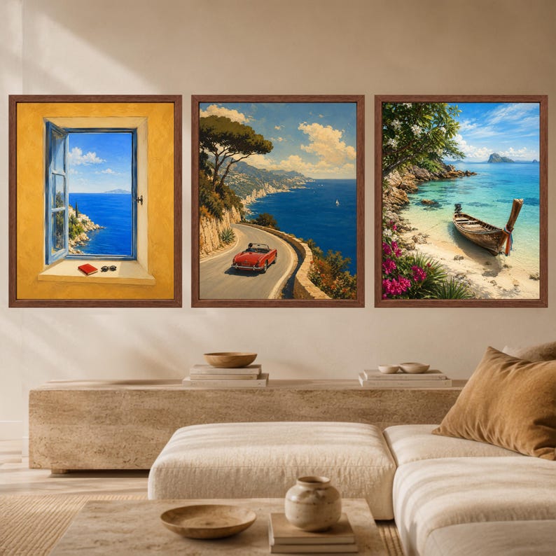 May include: A set of three framed wall art prints featuring coastal scenes. The left print shows an open window overlooking the sea, the center print depicts a red convertible on a cliffside road, and the right print shows a boat on a beach.