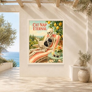 May include: A rectangular wall art print titled Cat Nap Eternal featuring a skeleton reclining on a striped lounge chair while holding a black cat and a book. The scene includes a lemon tree, a coastal landscape, and a small table with a drink.