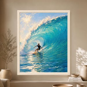 Framed surfing wall art showing a surfer riding inside a large turquoise blue ocean wave with white sea foam, bright sunlight and textured painterly brushwork.