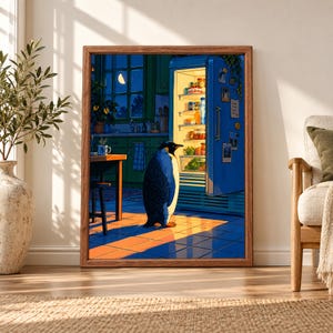 Framed penguin wall art showing a penguin standing in a dark blue kitchen in front of an open refrigerator glowing with warm light, with a crescent moon visible through the window.