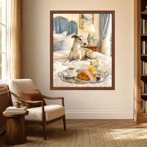 May include: A framed wall art print depicting a brindle whippet dog resting on a white bed with a silver breakfast tray featuring a croissant, a cup of coffee, a glass of orange juice, and a small jar of jam, set in a bedroom with blue accents.
