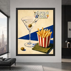 Framed Martini and Fries wall art showing a clear martini glass with green olive beside golden French fries in a red striped carton, with retro lettering and bold blue accents.