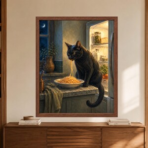 Framed black cat kitchen wall art showing a cat eating spaghetti from a plate beside an open refrigerator at night, with warm fridge light, dark blue walls and a crescent moon outside the window.