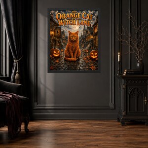 May include: A framed wall art print titled The Orange Cat of Witch Lane, featuring a ginger cat sitting on a cobblestone street at night, surrounded by glowing jack-o'-lanterns, autumn leaves, and a dark, atmospheric village background.