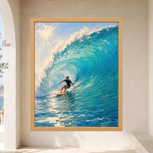 May include: A framed wall art print depicting a surfer riding a large, curling turquoise ocean wave. The scene features a person on a surfboard within the barrel of the wave, with bright sunlight reflecting off the water and white sea foam.