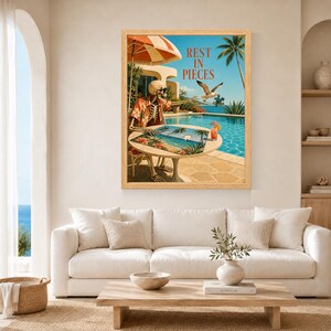 May include: A framed wall art print featuring a skeleton wearing an orange floral shirt and sunglasses, sitting at a round table by a swimming pool. The skeleton is assembling a puzzle while a seagull flies nearby. The text reads REST IN PIECES.