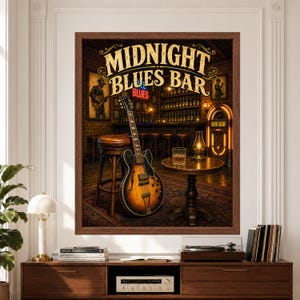 Framed Midnight Blues Bar wall art featuring a vintage electric guitar beside a leather bar stool in a warm brick blues lounge with glowing jukebox, framed musician portraits, dark wood bar and amber lighting above a record player console.