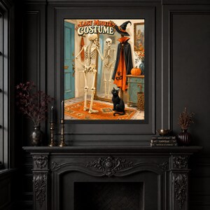 May include: A framed wall art print titled LAST MINUTE COSTUME featuring a skeleton standing before a mirror, wearing a black and orange cape and a witch hat. A black cat sits on an orange rug near a blue door, a pumpkin, and a wooden cabinet.
