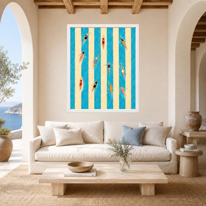 May include: A framed wall art print featuring an aerial view of swimmers in various colored swimsuits, including red, blue, yellow, and black, positioned within vertical stripes of alternating light blue and cream colors on a white background.