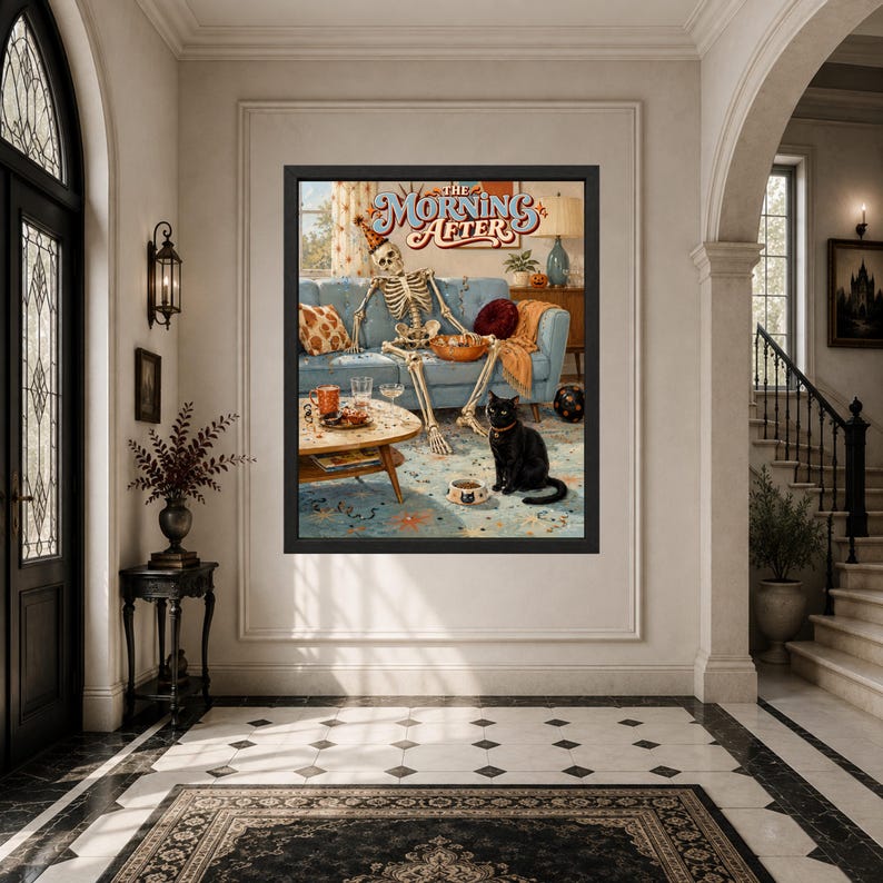 May include: A framed wall art print titled The Morning After, featuring a skeleton wearing a party hat lounging on a blue sofa with a black cat sitting on the floor in front of a coffee table with drinks and a bowl of food in a living room.