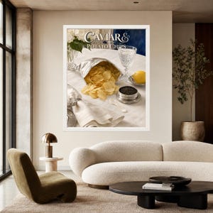 May include: A framed wall art print titled Caviar & Potato Chips featuring a silver foil bag of golden potato chips, a small silver tin of black caviar, a crystal glass, a lemon, and a white cloth napkin with a silver napkin ring on a table.