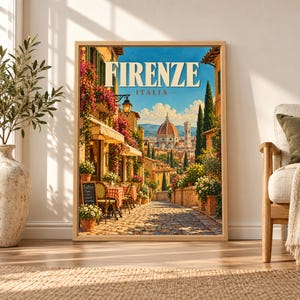 Framed Firenze Italy travel poster showing the Florence Duomo beyond a sunny cobblestone street with trattoria tables, flower-covered buildings, cypress trees and warm Tuscan rooftops.